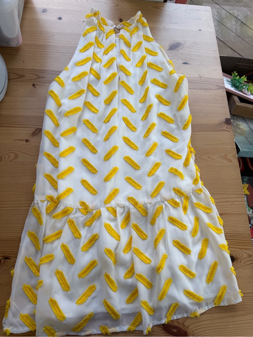 White Dress with Yellow Tassel Embellishments